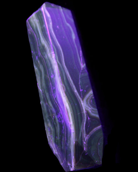 Tall Chocolate Calcite obelisk 154*32mm 439g in UV light - Rocks and Things Store
