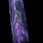 Tall Chocolate Calcite obelisk 154*32mm 439g in UV light - Rocks and Things Store