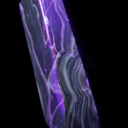 Tall Chocolate Calcite obelisk 154*32mm 439g in UV light - Rocks and Things Store