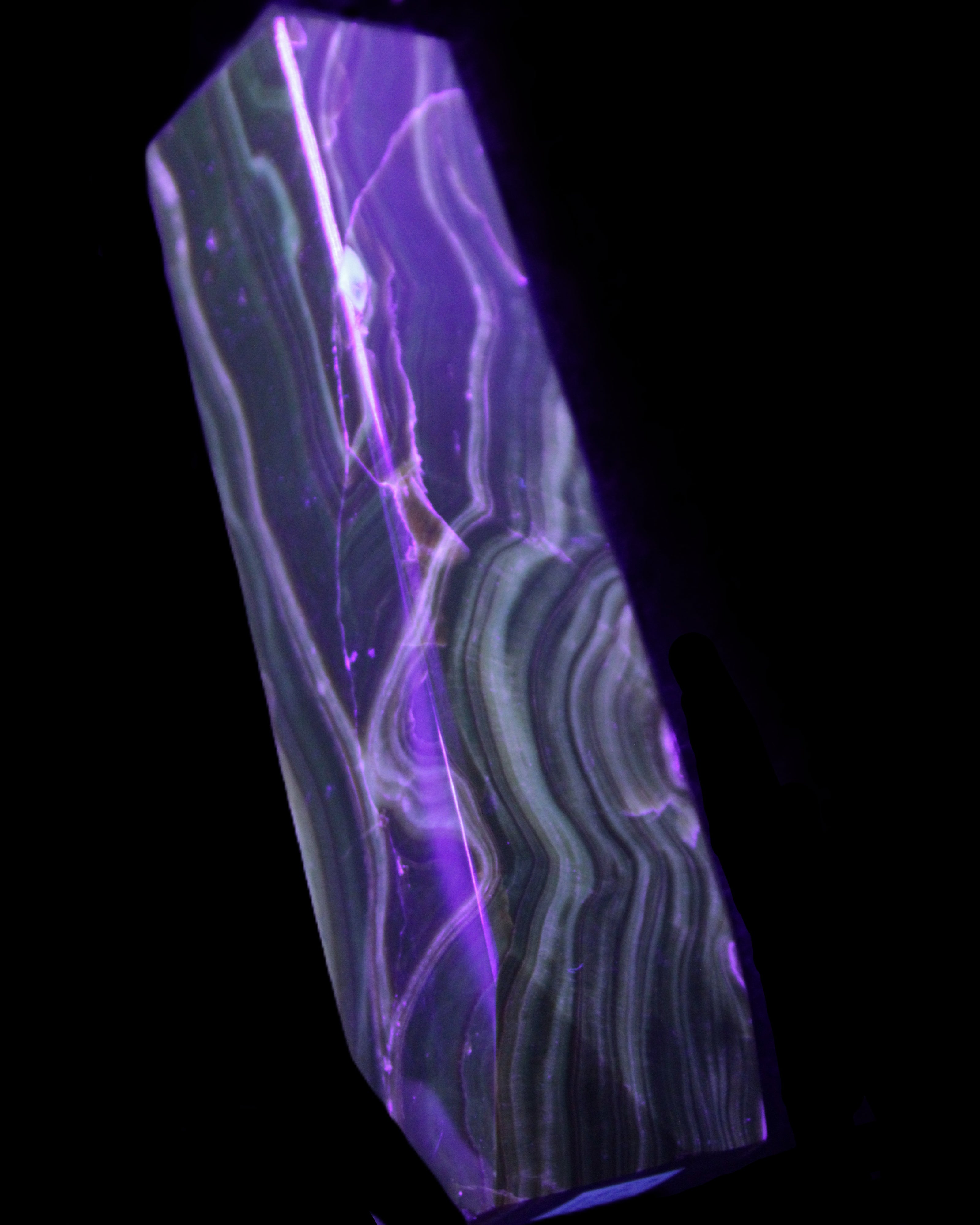 Tall Chocolate Calcite obelisk 154*32mm 439g in UV light - Rocks and Things Store