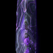 Tall Chocolate Calcite obelisk 154*32mm 439g in UV light - Rocks and Things Store
