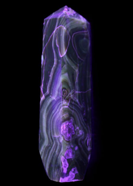 Tall Chocolate Calcite obelisk 154*32mm 439g in UV light - Rocks and Things Store