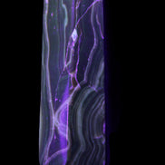 Tall Chocolate Calcite obelisk 154*32mm 439g in UV light - Rocks and Things Store