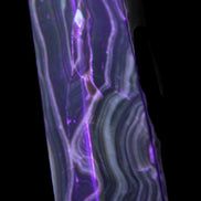 Tall Chocolate Calcite obelisk 154*32mm 439g in UV light - Rocks and Things Store