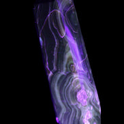 Tall Chocolate Calcite obelisk 154*32mm 439g in UV light - Rocks and Things Store