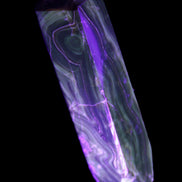 Tall Chocolate Calcite obelisk 154*32mm 439g in UV light - Rocks and Things Store