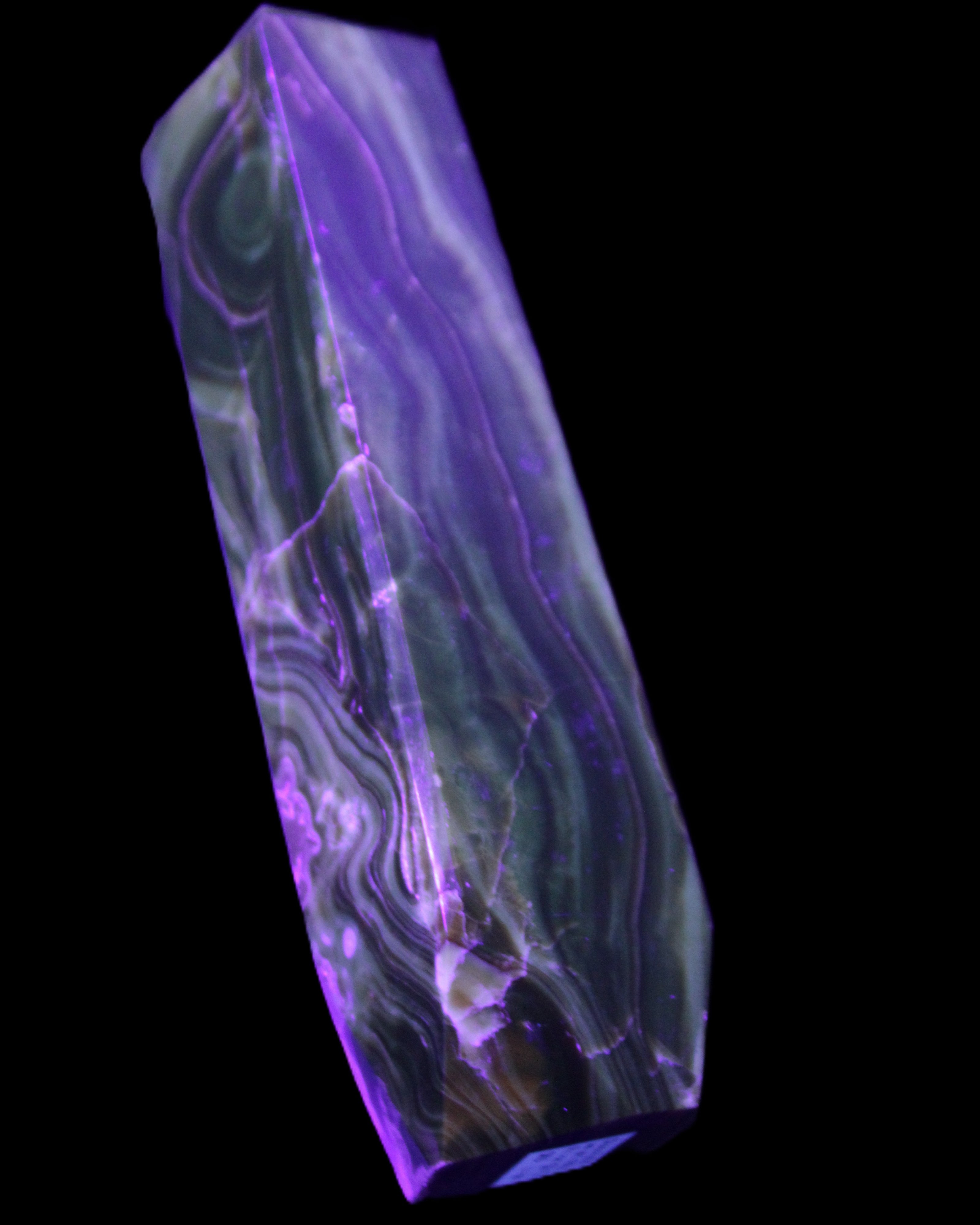 Tall Chocolate Calcite obelisk 154*32mm 439g in UV light - Rocks and Things Store