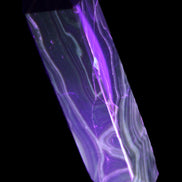 Tall Chocolate Calcite obelisk 154*32mm 439g in UV light - Rocks and Things Store
