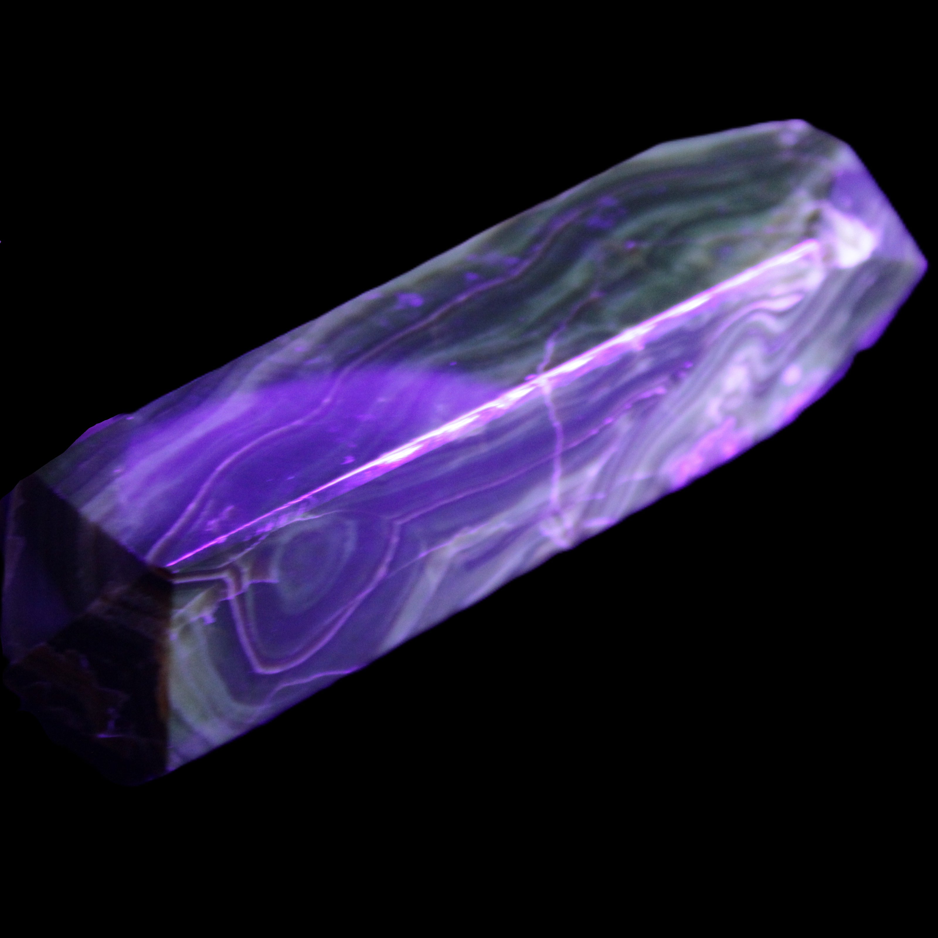 Tall Chocolate Calcite obelisk 154*32mm 439g in UV light - Rocks and Things Store