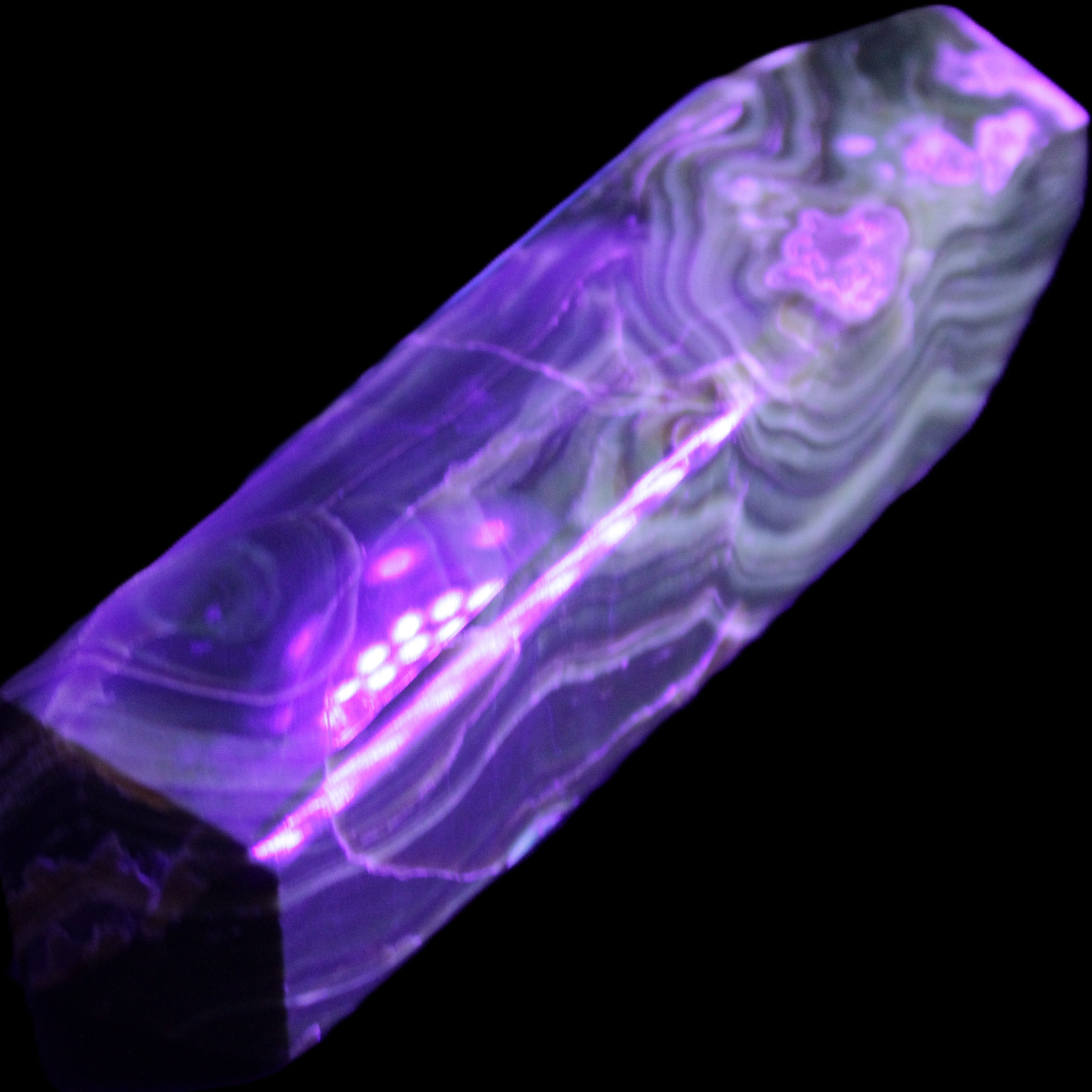 Tall Chocolate Calcite obelisk 154*32mm 439g in UV light - Rocks and Things Store