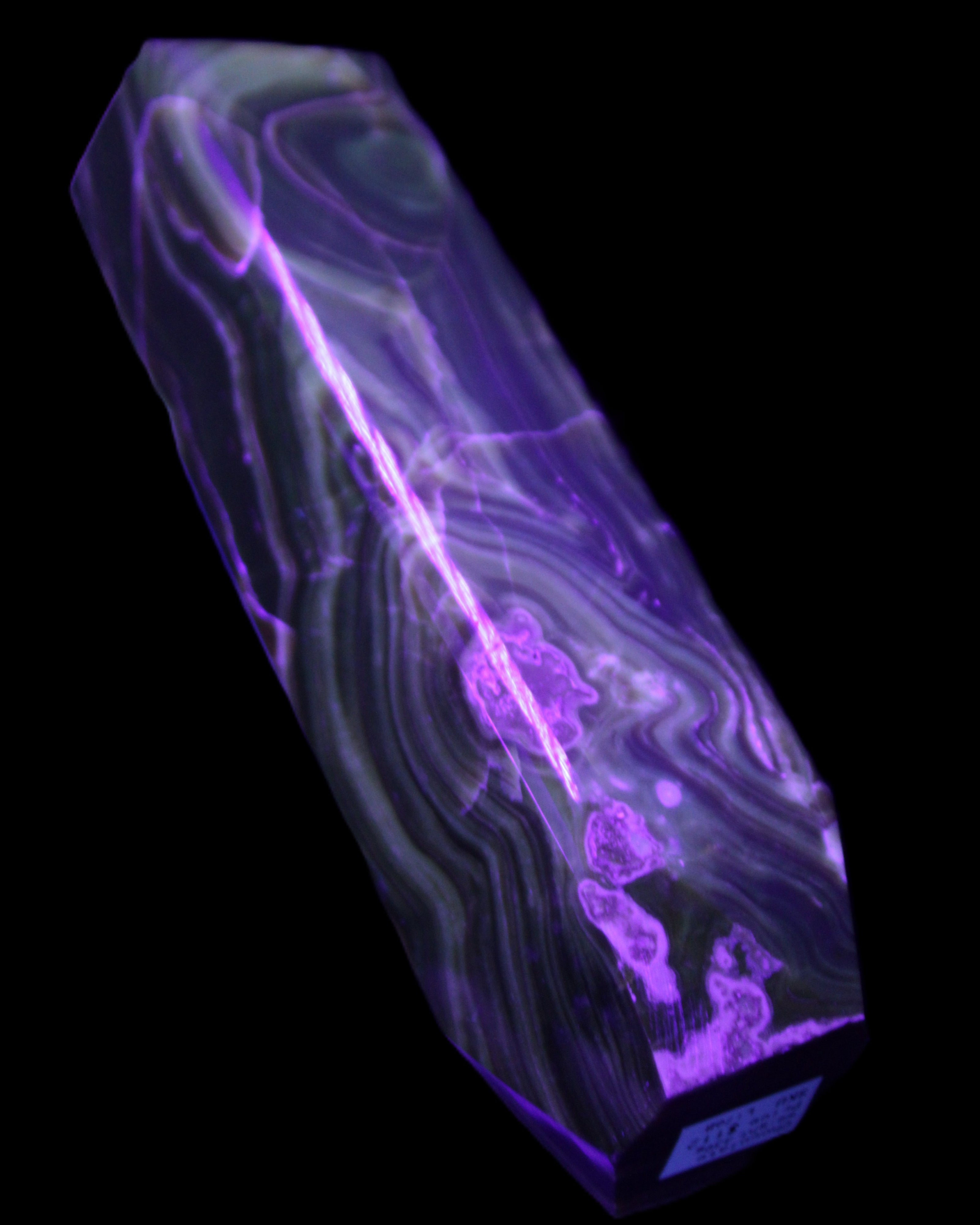 Tall Chocolate Calcite obelisk 154*32mm 439g in UV light - Rocks and Things Store