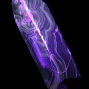 Tall Chocolate Calcite obelisk 154*32mm 439g in UV light - Rocks and Things Store