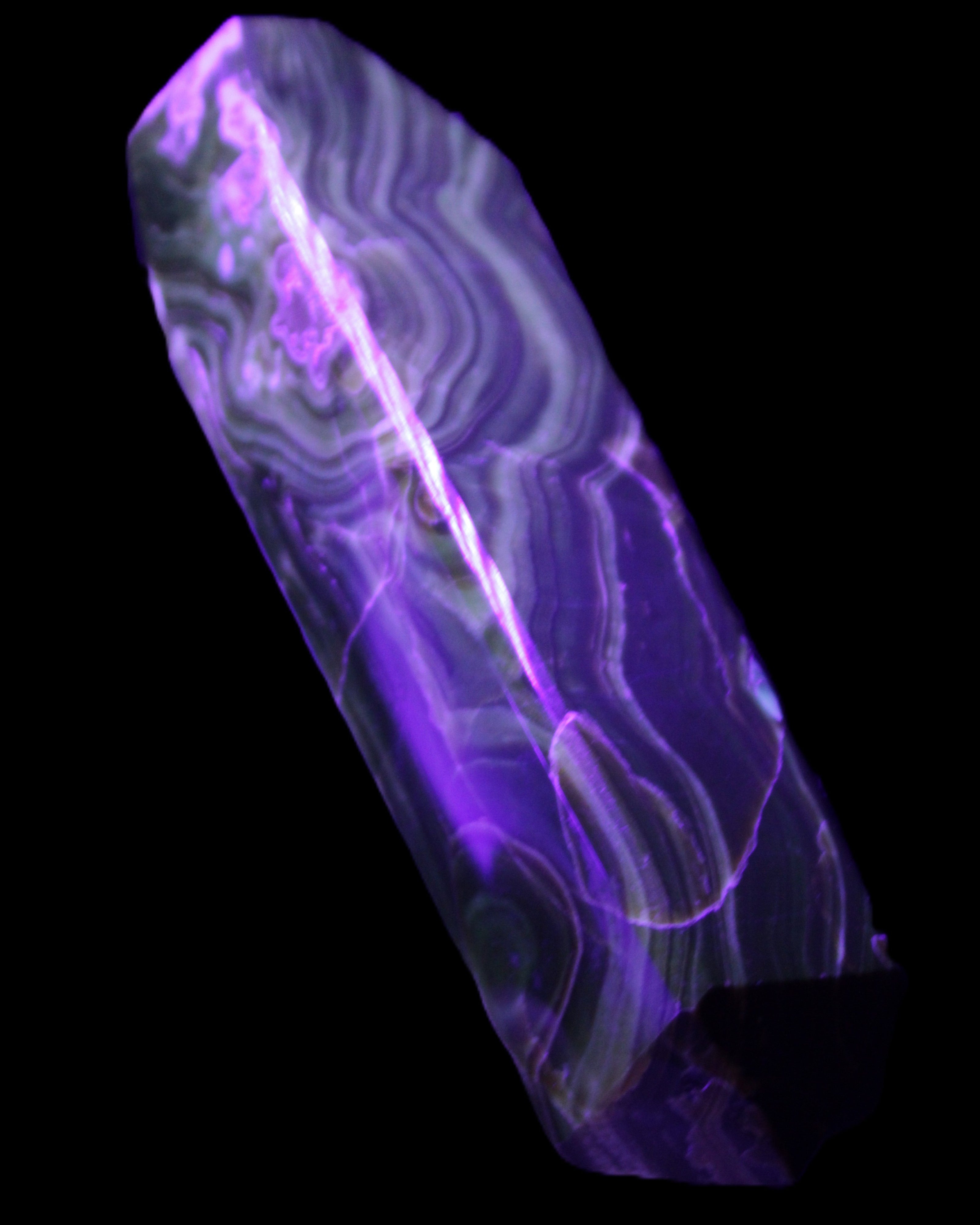 Tall Chocolate Calcite obelisk 154*32mm 439g in UV light - Rocks and Things Store