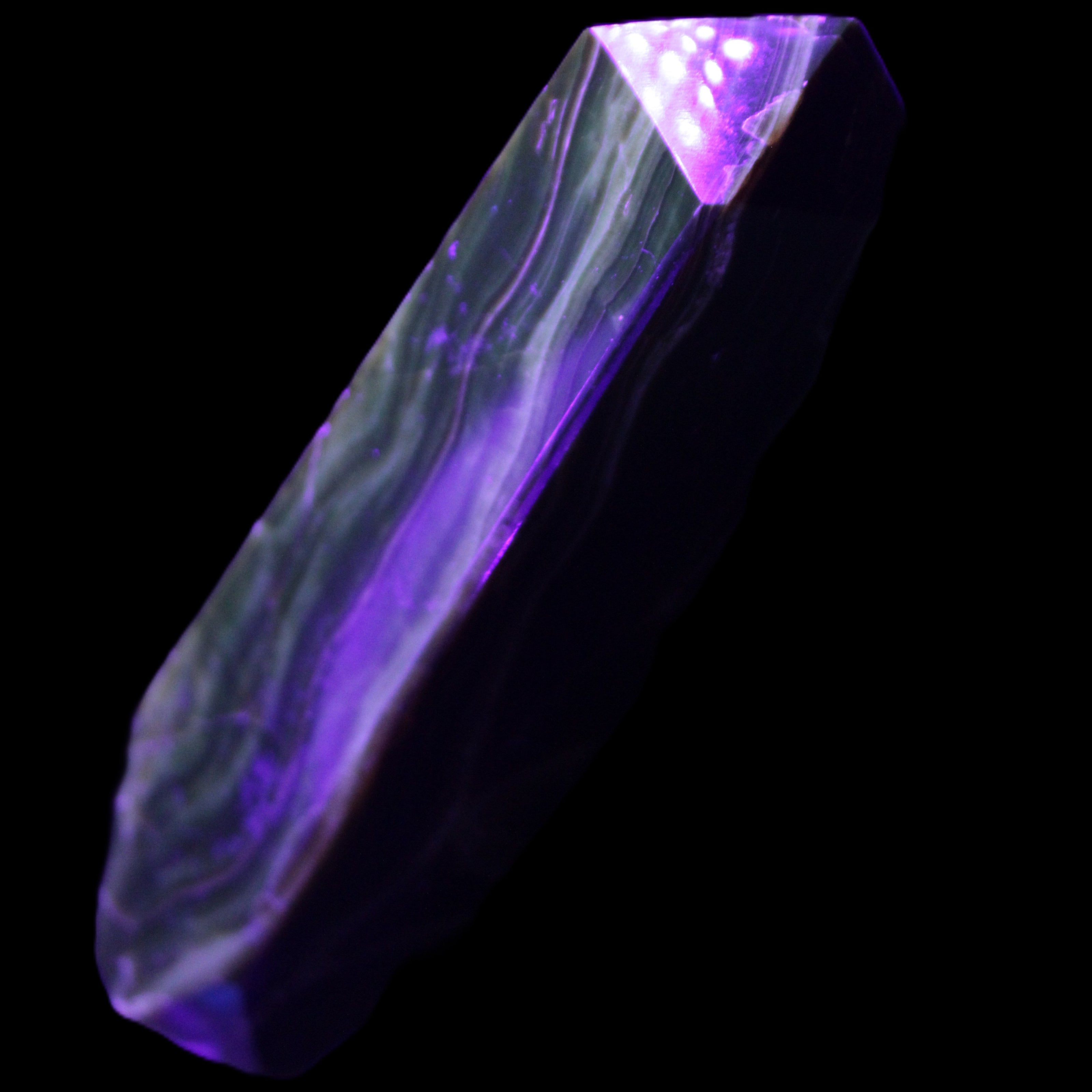 Tall Chocolate Calcite obelisk 154*32mm 439g in UV light - Rocks and Things Store