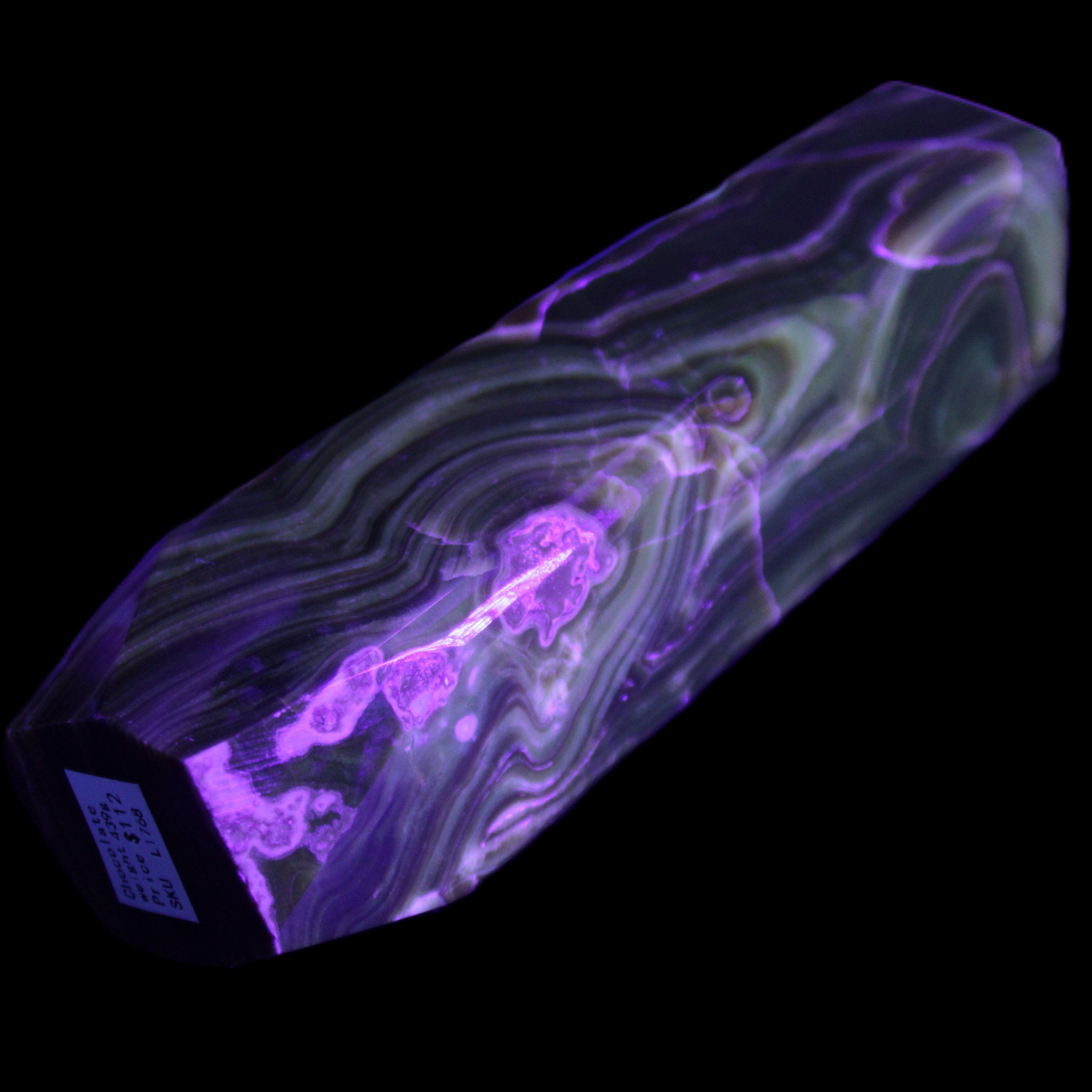 Tall Chocolate Calcite obelisk 154*32mm 439g in UV light - Rocks and Things Store