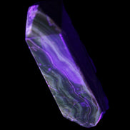 Tall Chocolate Calcite obelisk 154*32mm 439g in UV light - Rocks and Things Store