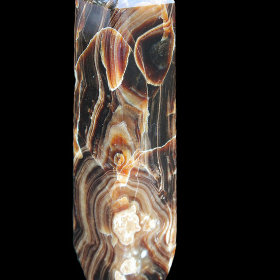 Tall Chocolate Calcite obelisk 154*32mm 439g in UV light - Rocks and Things Store