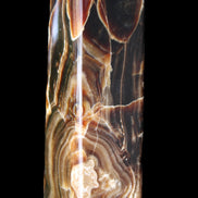 Tall Chocolate Calcite obelisk 154*32mm 439g in UV light - Rocks and Things Store