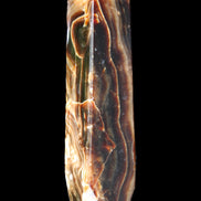 Tall Chocolate Calcite obelisk 154*32mm 439g in UV light - Rocks and Things Store