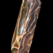 Tall Chocolate Calcite obelisk 154*32mm 439g in UV light - Rocks and Things Store