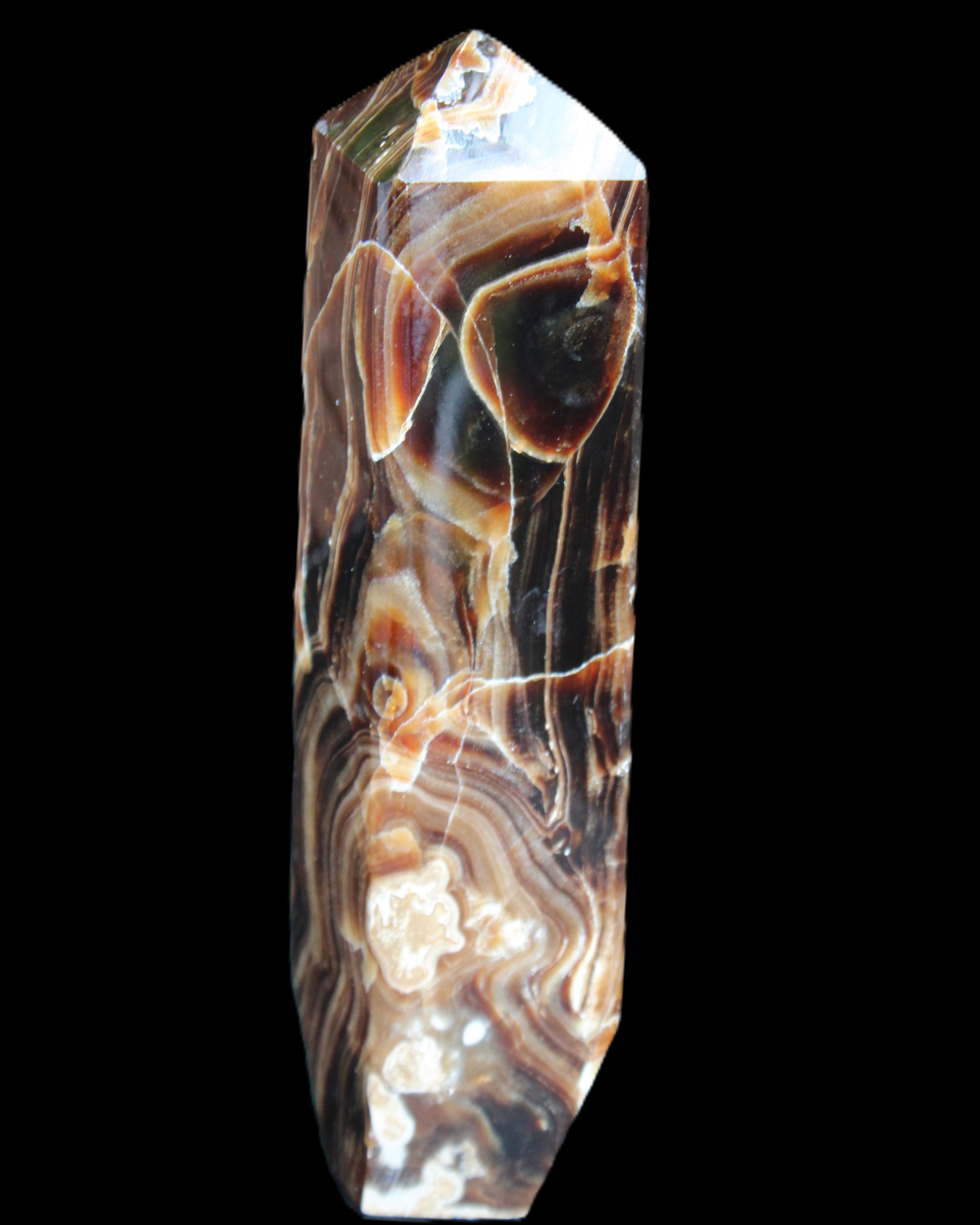 Tall Chocolate Calcite obelisk 154*32mm 439g in UV light - Rocks and Things Store