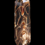 Tall Chocolate Calcite obelisk 154*32mm 439g in UV light - Rocks and Things Store