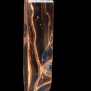 Tall Chocolate Calcite obelisk 154*32mm 439g in UV light - Rocks and Things Store