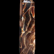 Tall Chocolate Calcite obelisk 154*32mm 439g in UV light - Rocks and Things Store