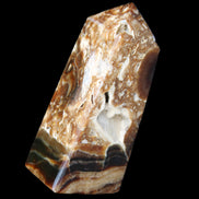 Chocolate Calcite obelisk with caves 95*40mm 217g in UV light - Rocks and Things Store