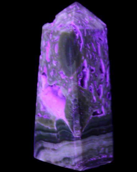 Chocolate Calcite obelisk with caves 95*40mm 217g in UV light - Rocks and Things Store
