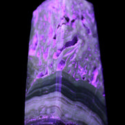 Chocolate Calcite obelisk with caves 95*40mm 217g in UV light - Rocks and Things Store