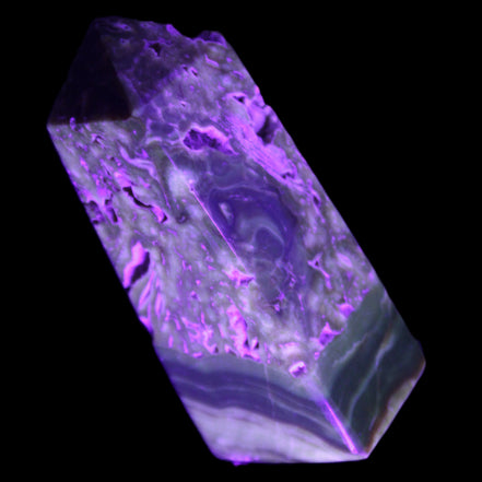 Chocolate Calcite obelisk with caves 95*40mm 217g in UV light - Rocks and Things Store