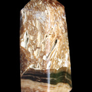 Chocolate Calcite obelisk with caves 95*40mm 217g in UV light - Rocks and Things Store