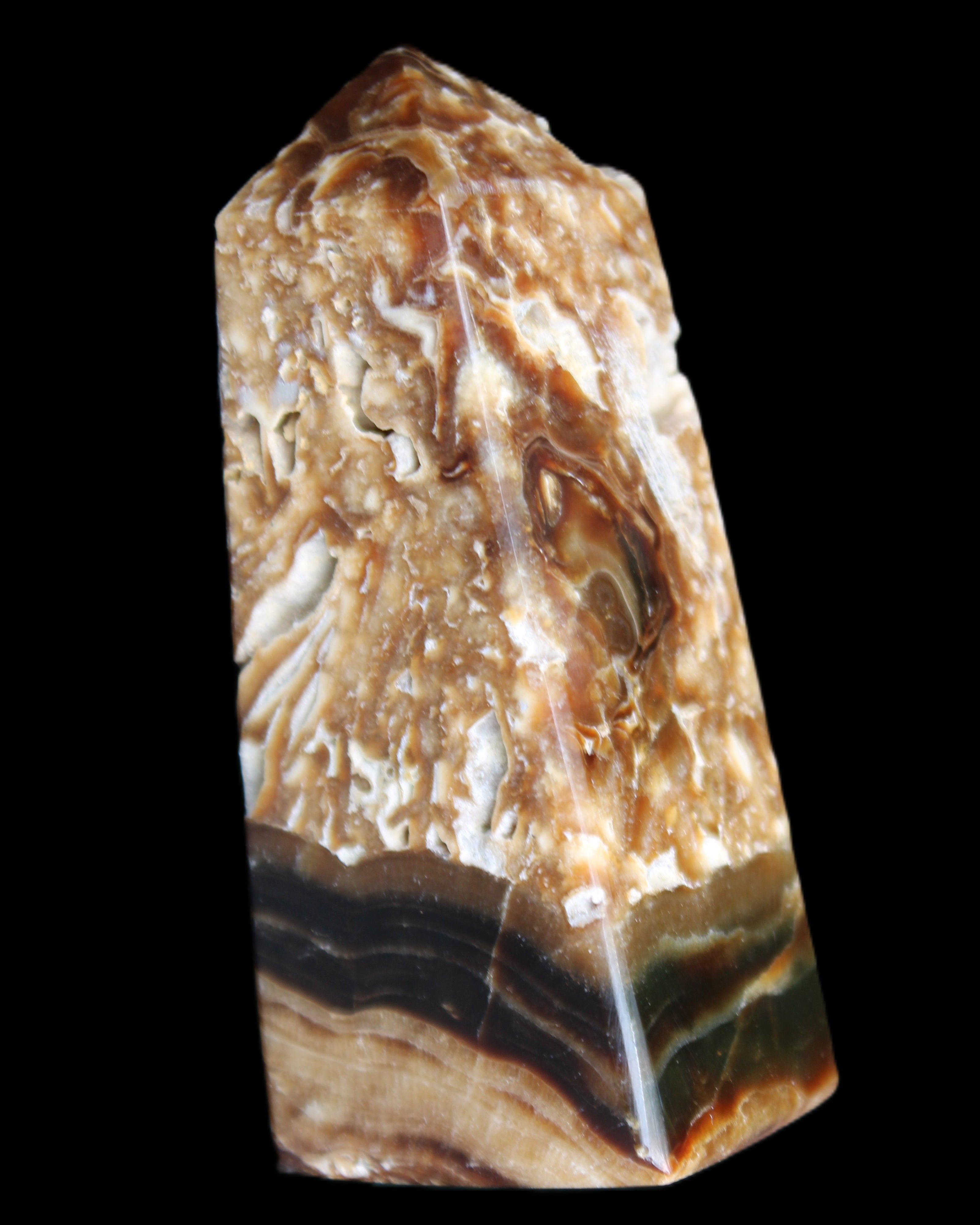 Chocolate Calcite obelisk with caves 95*40mm 217g in UV light - Rocks and Things Store