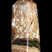 Chocolate Calcite obelisk with caves 95*40mm 217g in UV light - Rocks and Things Store