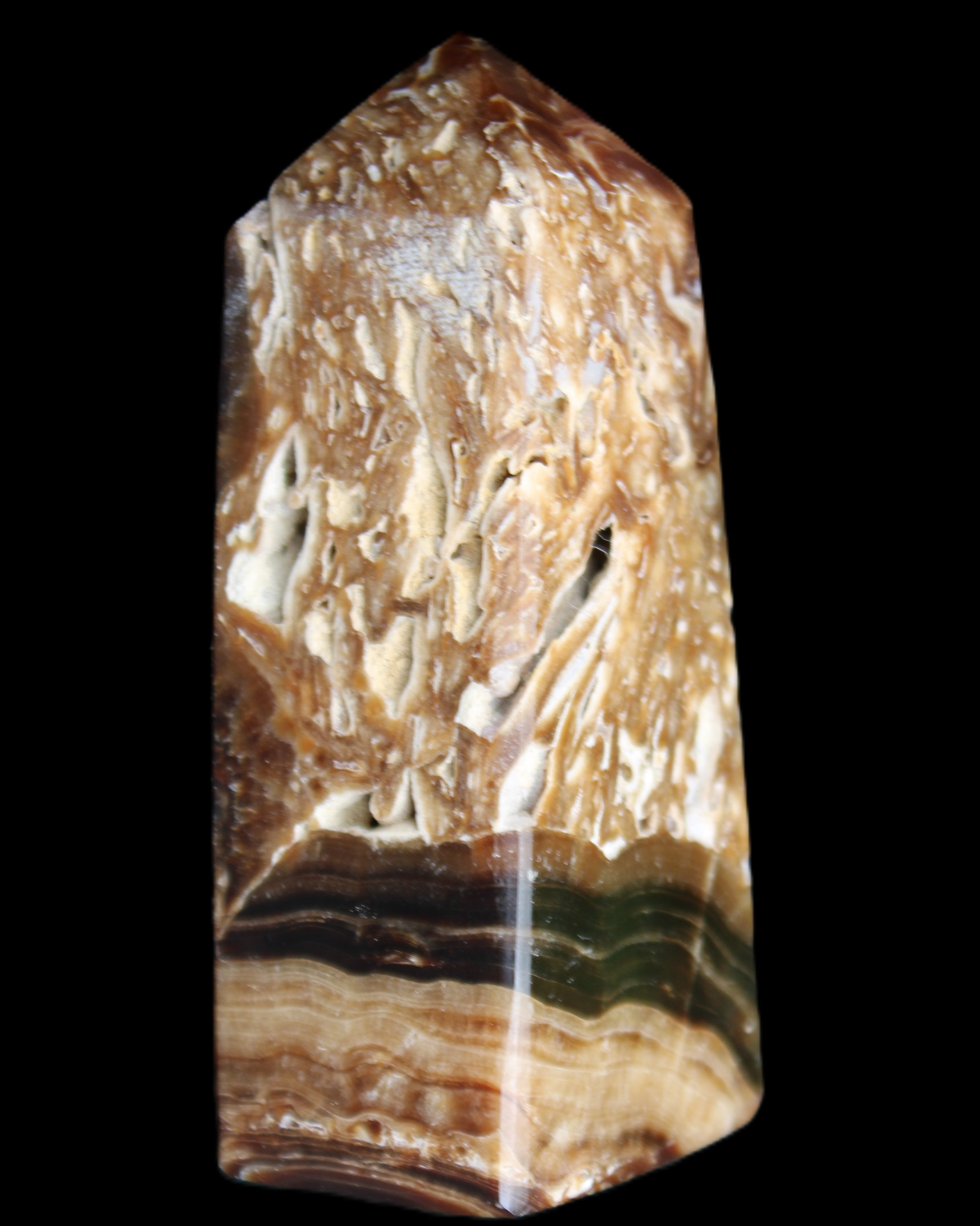 Chocolate Calcite obelisk with caves 95*40mm 217g in UV light - Rocks and Things Store