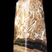 Chocolate Calcite obelisk with caves 95*40mm 217g in UV light - Rocks and Things Store