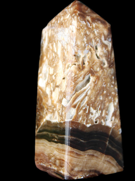 Chocolate Calcite obelisk with caves 95*40mm 217g in UV light - Rocks and Things Store