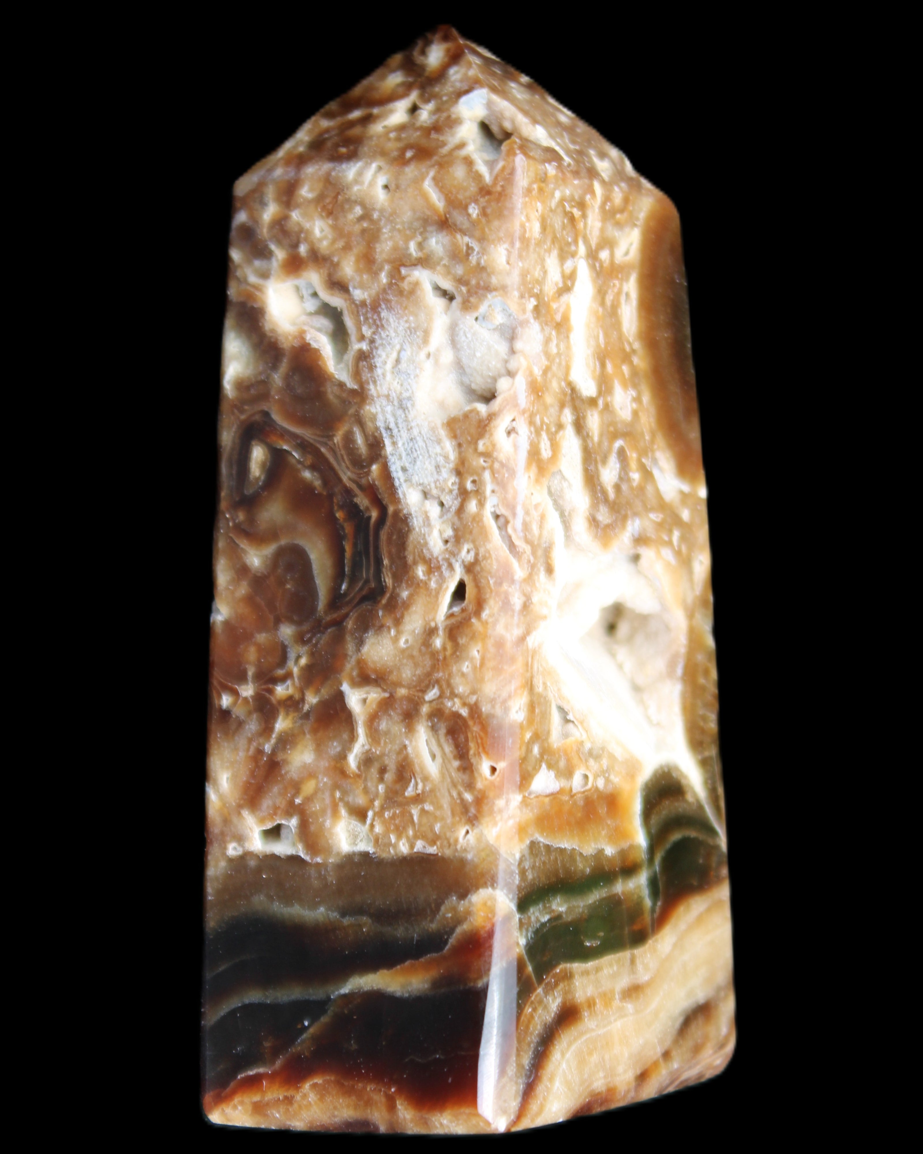 Chocolate Calcite obelisk with caves 95*40mm 217g in UV light - Rocks and Things Store