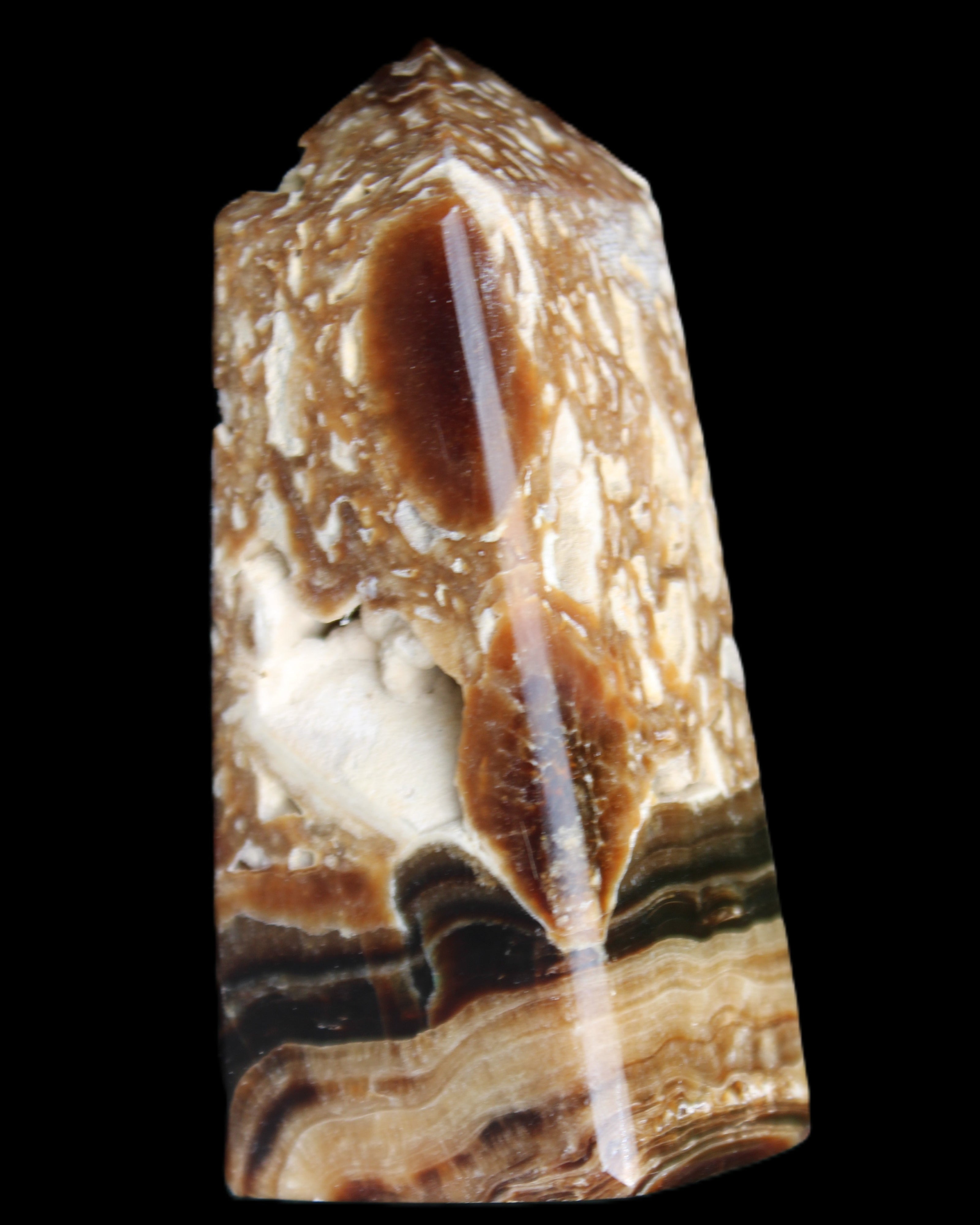 Chocolate Calcite obelisk with caves 95*40mm 217g in UV light - Rocks and Things Store