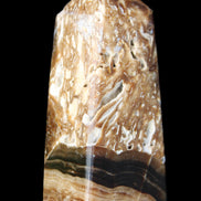 Chocolate Calcite obelisk with caves 95*40mm 217g in UV light - Rocks and Things Store