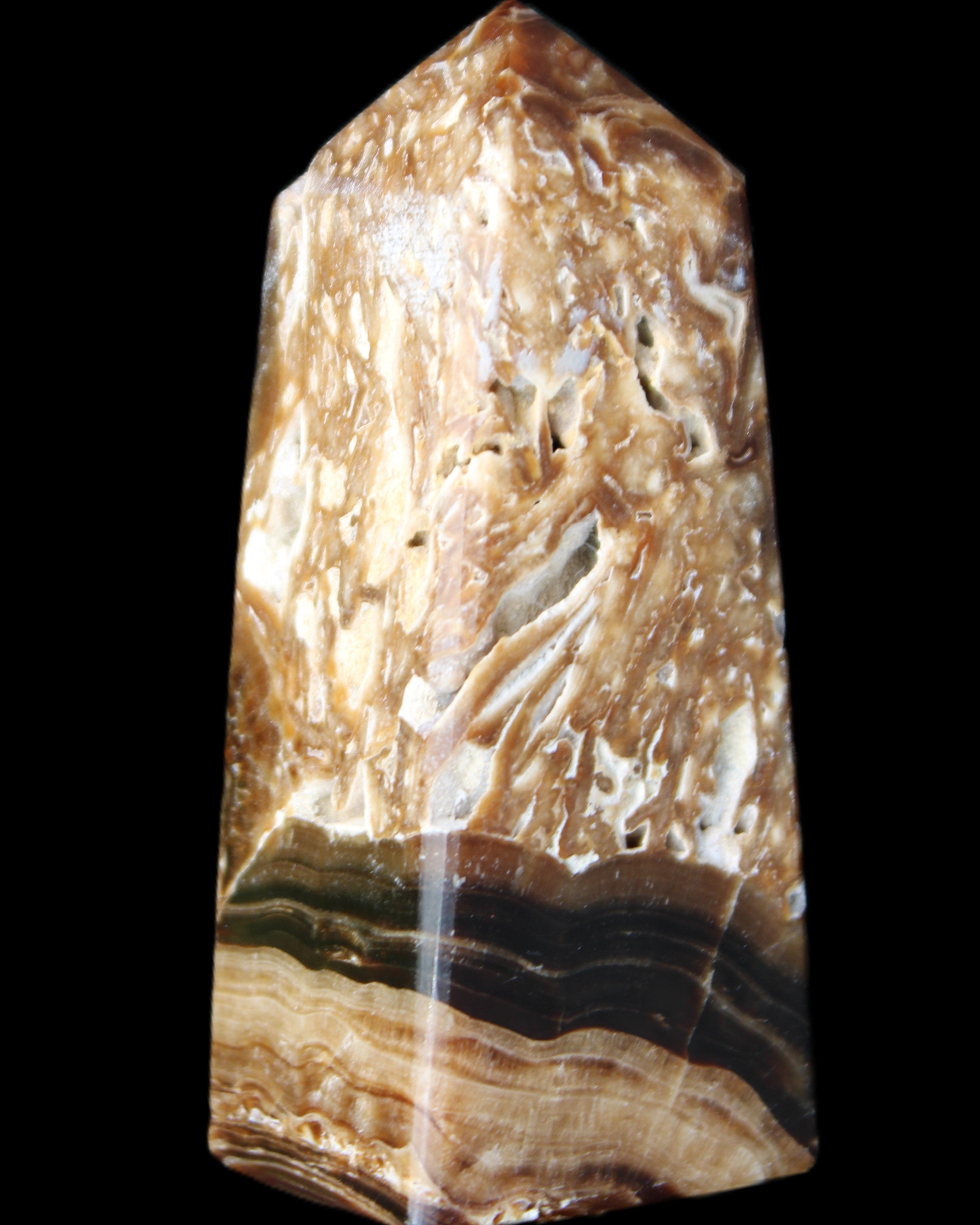 Chocolate Calcite obelisk with caves 95*40mm 217g in UV light - Rocks and Things Store