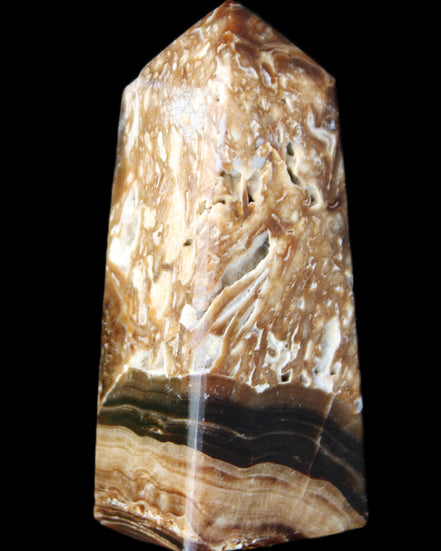 Chocolate Calcite obelisk with caves 95*40mm 217g in UV light - Rocks and Things Store