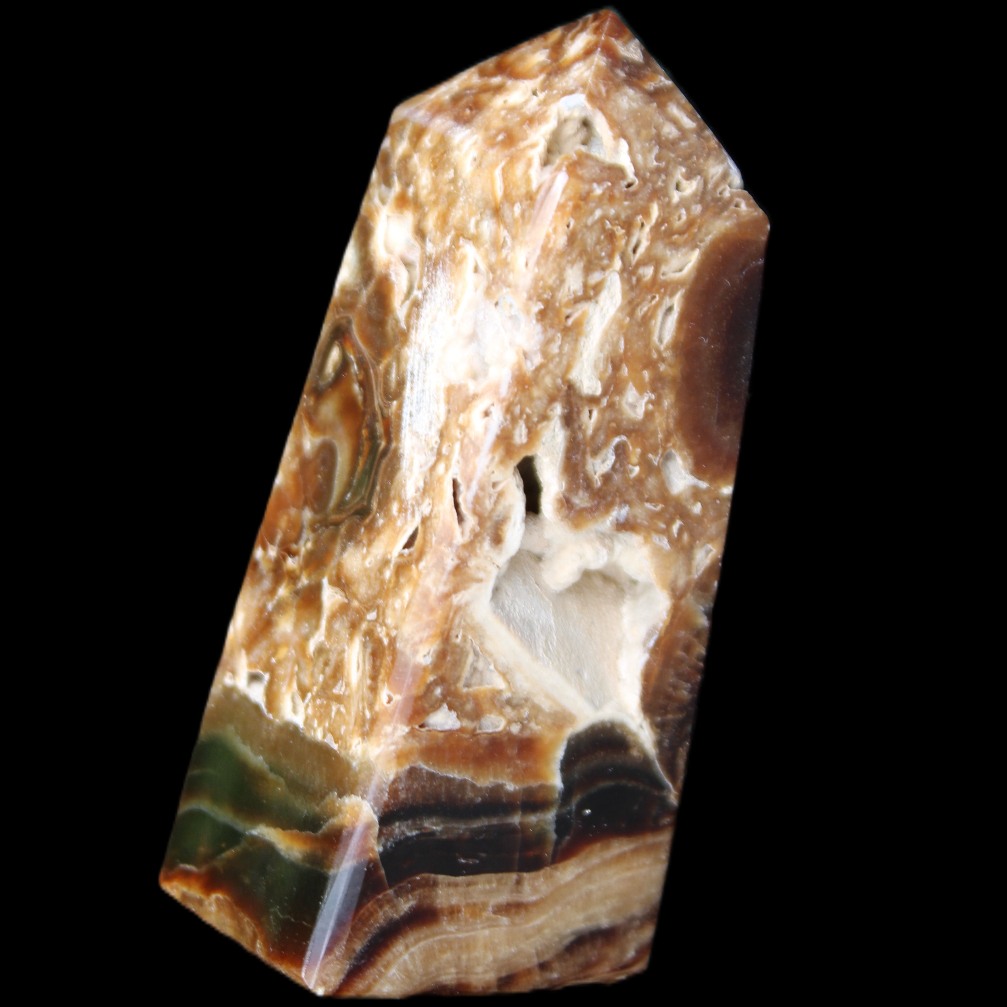 Chocolate Calcite obelisk with caves 95*40mm 217g in UV light - Rocks and Things Store