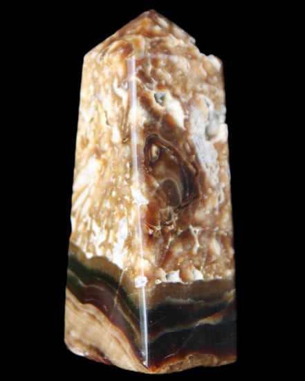 Chocolate Calcite obelisk with caves 95*40mm 217g in UV light - Rocks and Things Store