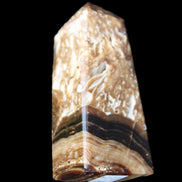 Chocolate Calcite obelisk with caves 95*40mm 217g in UV light - Rocks and Things Store