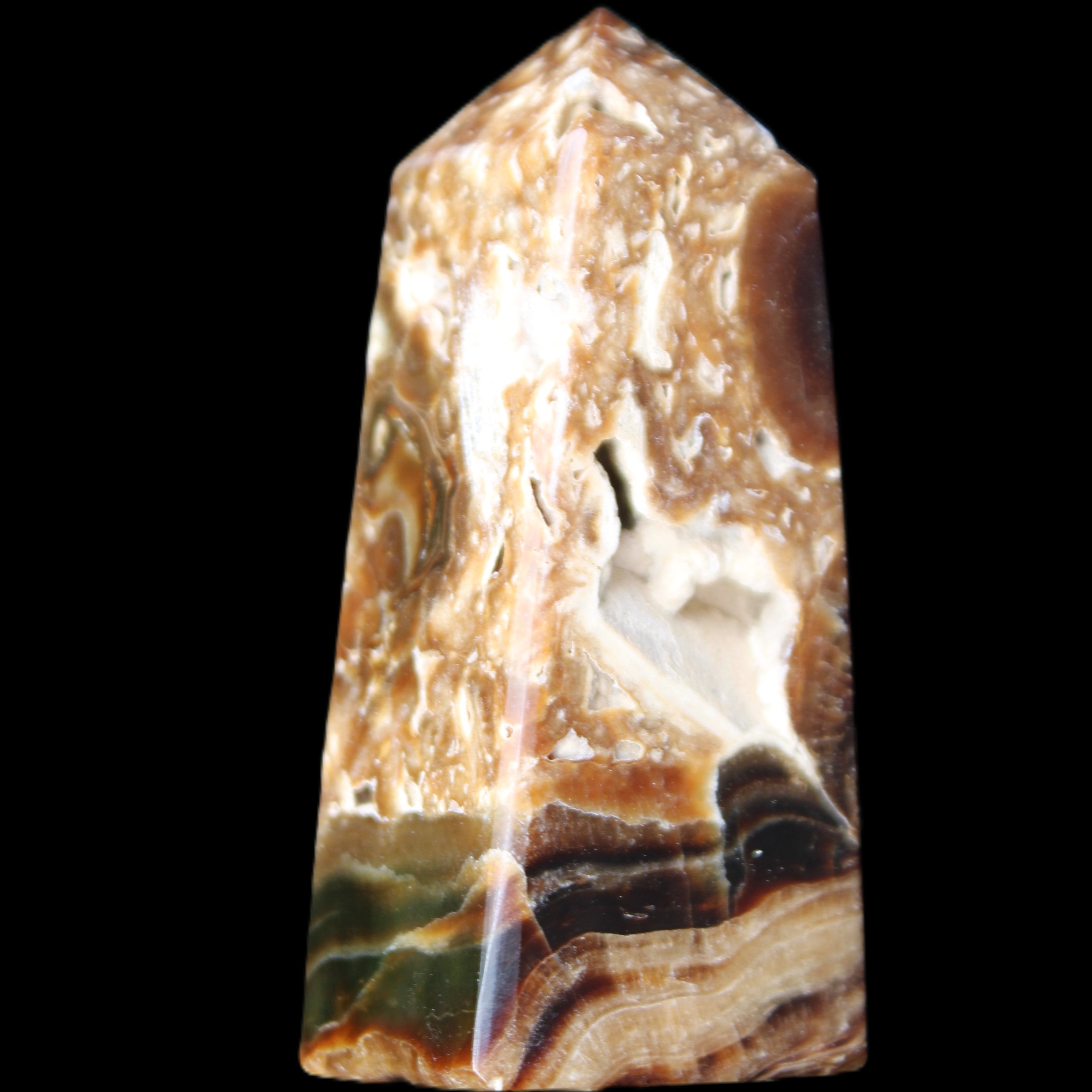 Chocolate Calcite obelisk with caves 95*40mm 217g in UV light - Rocks and Things Store