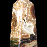 Chocolate Calcite obelisk with caves 95*40mm 217g in UV light - Rocks and Things Store