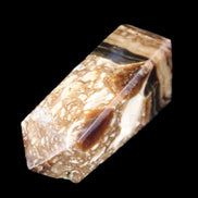 Chocolate Calcite obelisk with caves 95*40mm 217g in UV light - Rocks and Things Store