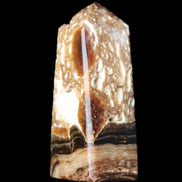 Chocolate Calcite obelisk with caves 95*40mm 217g in UV light - Rocks and Things Store